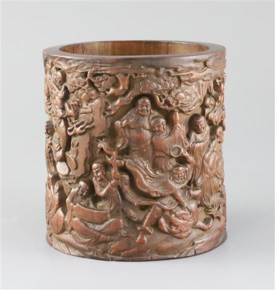 A Chinese bamboo eighteen luohan brush pot, late Qing dynasty, H.14cm